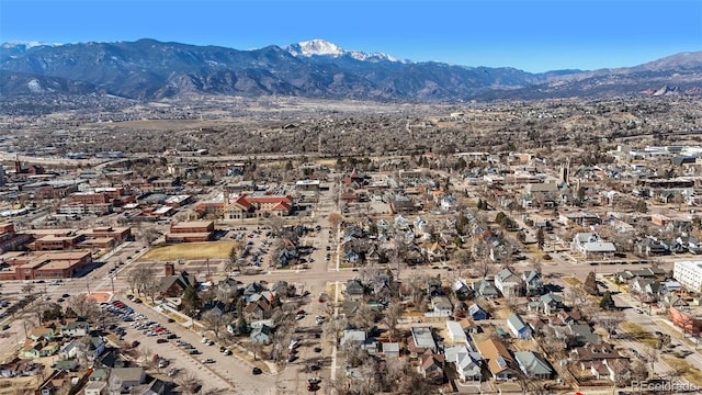 drone / aerial view featuring a residential view and a mountain view