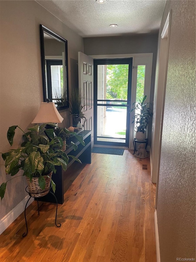 13660 Monroe St, Thornton, CO 80602 - entryway with a textured ceiling and wood finished floors