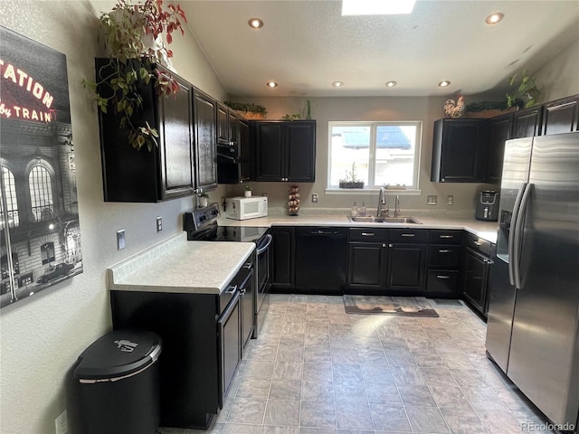 13660 Monroe St, Thornton, CO 80602 - kitchen with appliances with stainless steel finishes, recessed lighting, light countertops, and dark cabinets