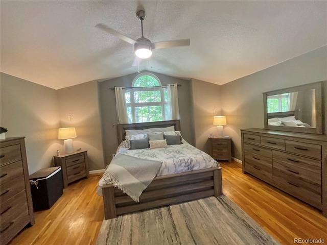 13660 Monroe St, Thornton, CO 80602 - bedroom with vaulted ceiling, light wood-style floors, a textured ceiling, and a ceiling fan