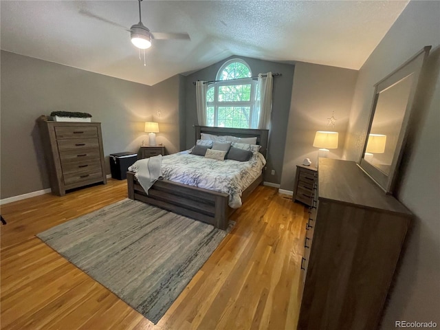 13660 Monroe St, Thornton, CO 80602 - bedroom with vaulted ceiling, light wood-type flooring, a ceiling fan, and a textured ceiling