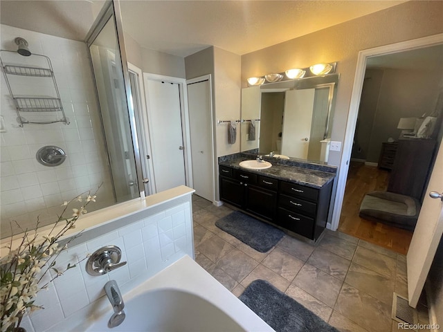 13660 Monroe St, Thornton, CO 80602 - full bathroom featuring a tub to relax in and vanity