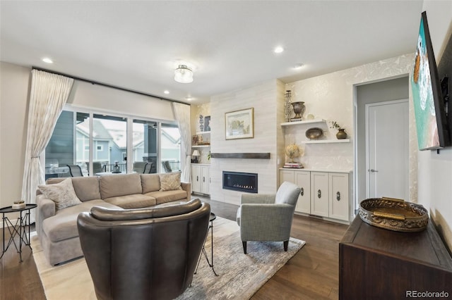 living room with hardwood / wood-style floors and a fireplace