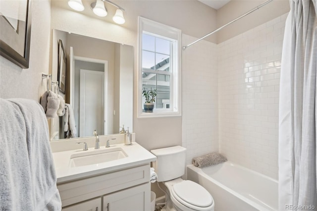bathroom featuring shower / tub combo, toilet, and vanity
