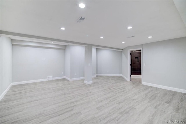 basement featuring light hardwood / wood-style flooring