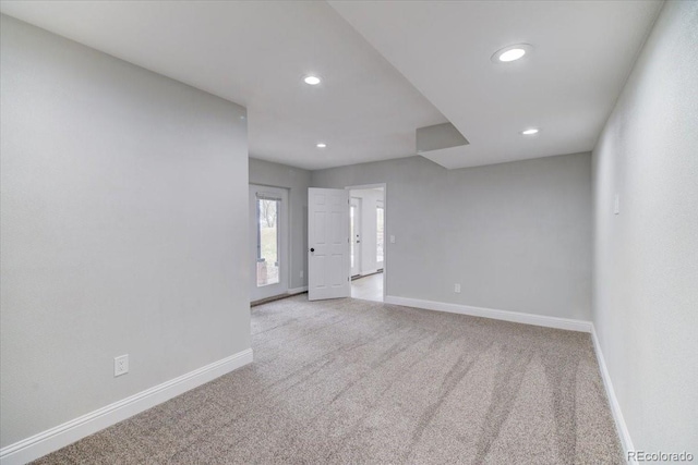 spare room with light colored carpet