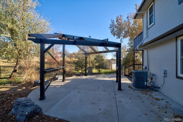 view of patio featuring a pergola, a shed, and central air condition unit