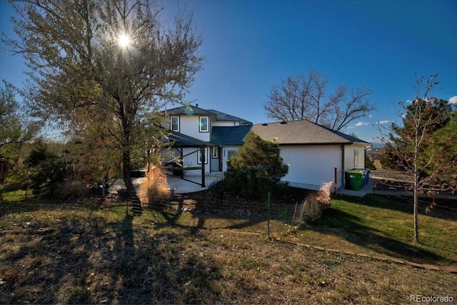 view of side of property featuring a yard