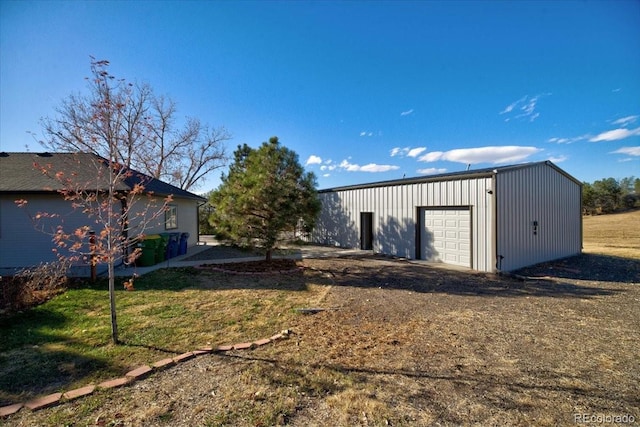 view of outbuilding featuring a garage