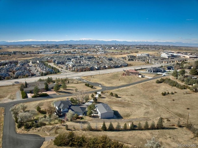 drone / aerial view featuring a mountain view