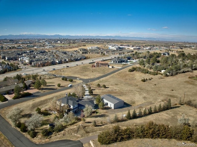 drone / aerial view featuring a mountain view