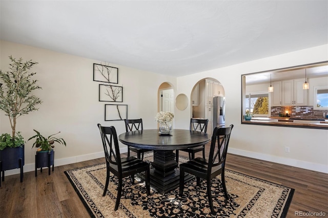 dining room with dark hardwood / wood-style floors