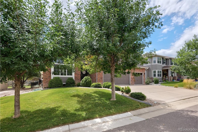 view of front facade featuring a garage and a front yard