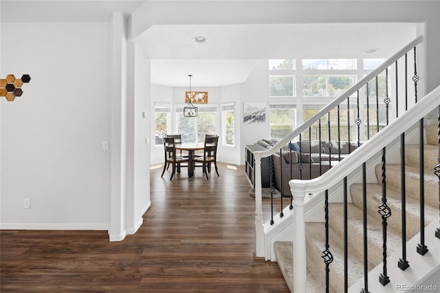 stairway featuring wood-type flooring