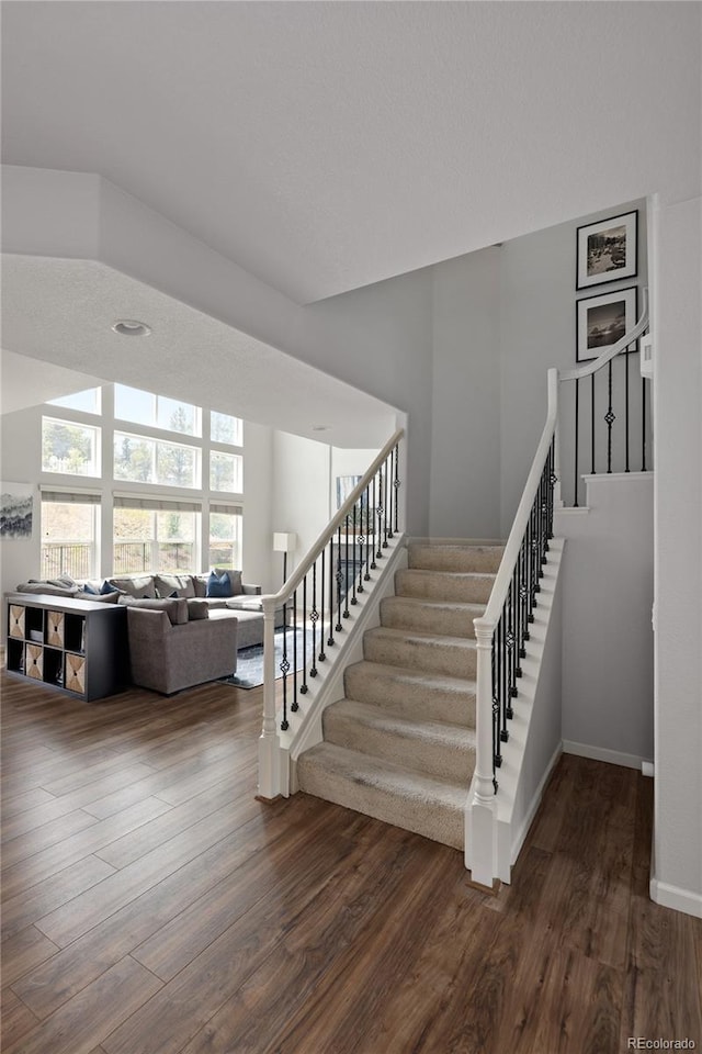 stairway featuring hardwood / wood-style floors