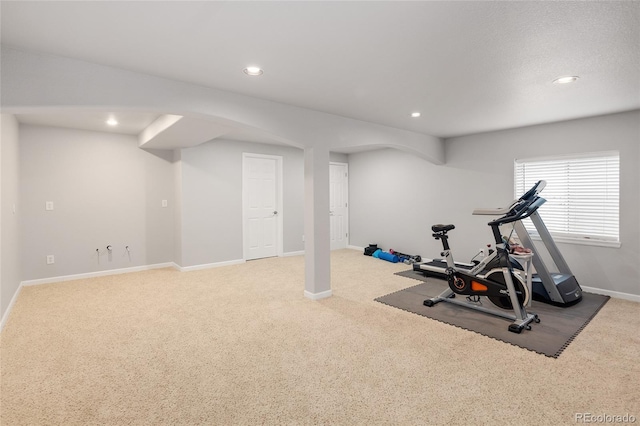 exercise area featuring carpet flooring