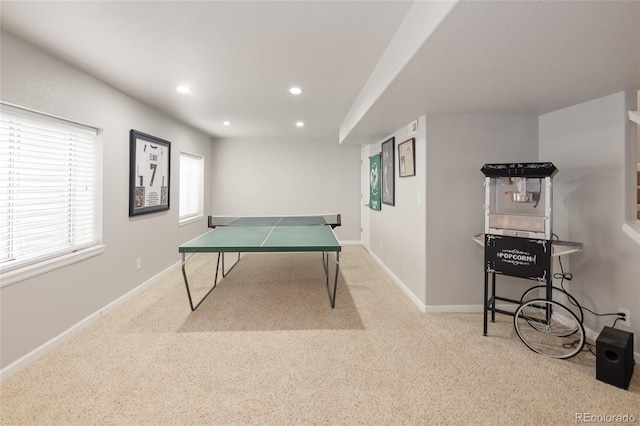 rec room with light colored carpet