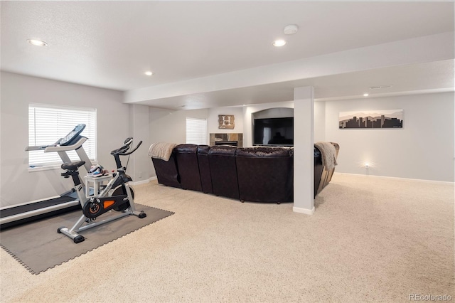 workout area featuring light carpet