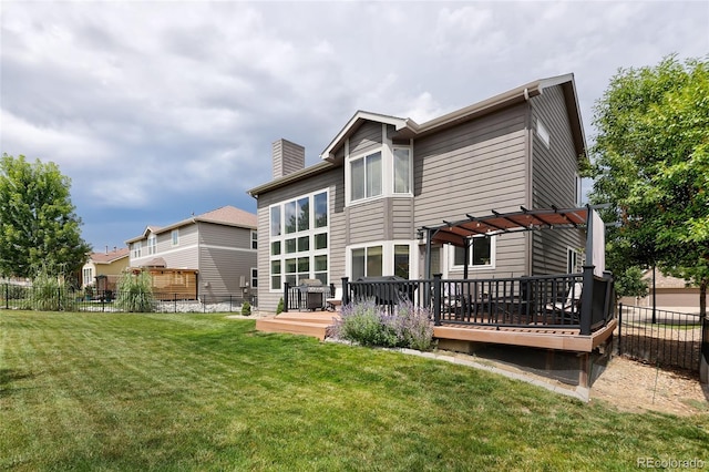 back of property featuring a wooden deck, a pergola, and a lawn