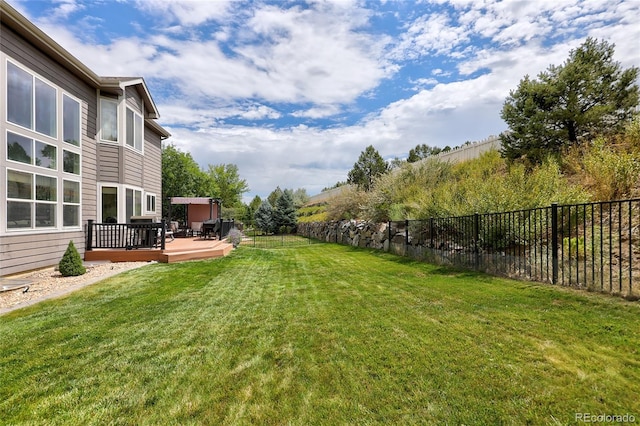 view of yard with a deck