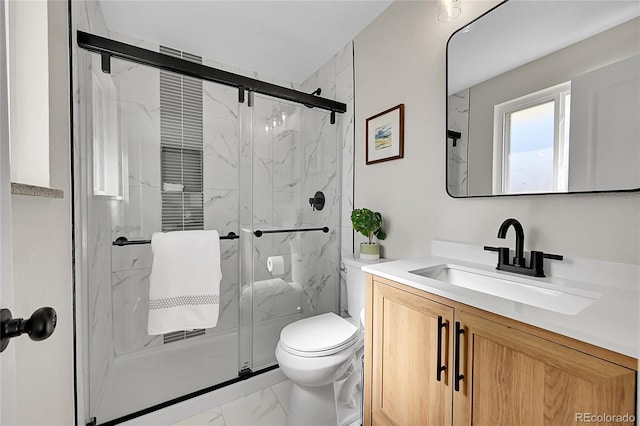 bathroom featuring vanity, toilet, and walk in shower