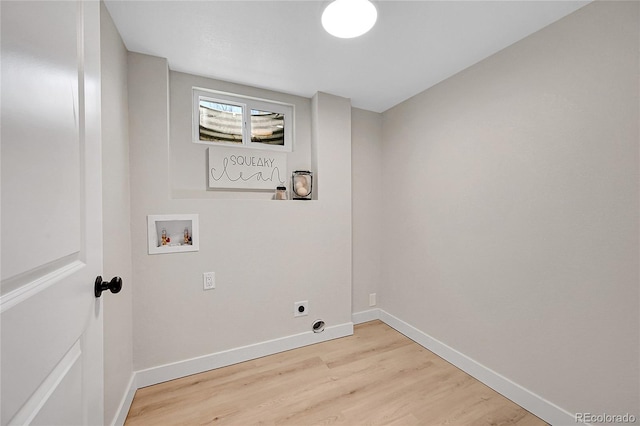 washroom with electric dryer hookup, washer hookup, and light hardwood / wood-style flooring