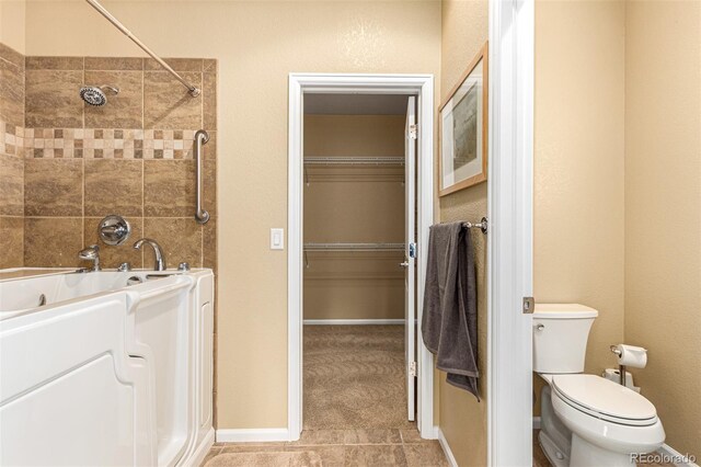 bathroom with tile patterned flooring, independent shower and bath, and toilet