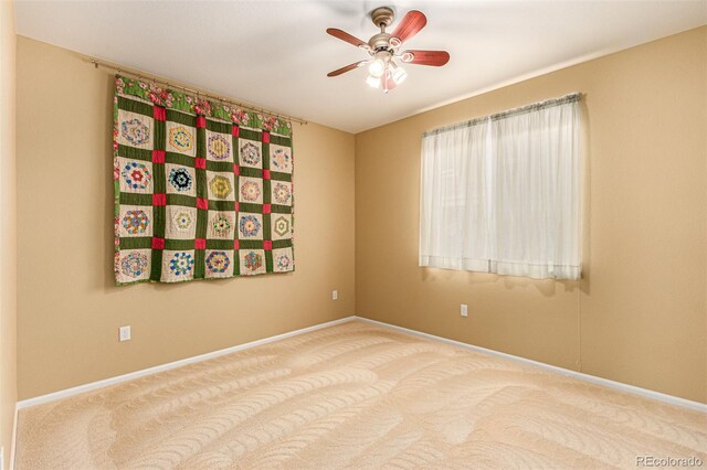 unfurnished room featuring carpet flooring and ceiling fan