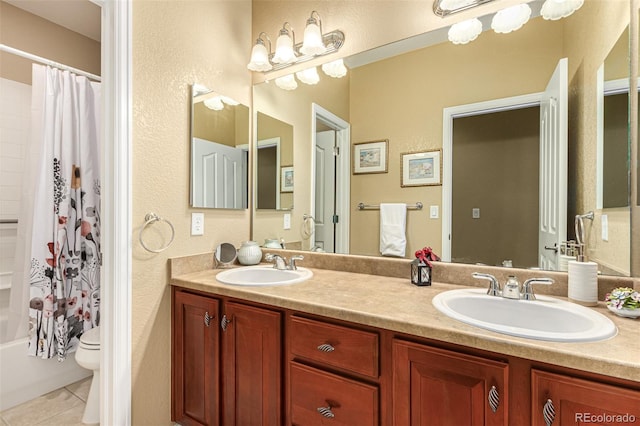 full bathroom featuring shower / bath combination with curtain, tile patterned floors, vanity, and toilet