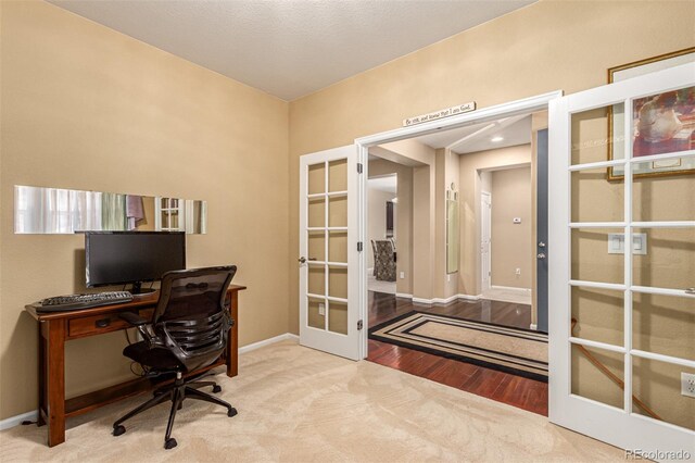 office space featuring french doors and hardwood / wood-style floors