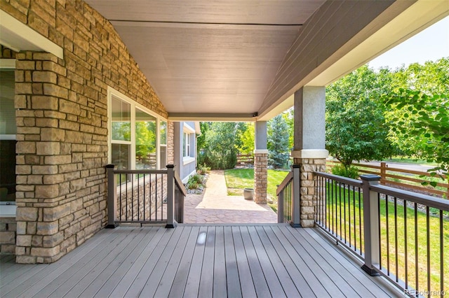 wooden terrace featuring covered porch