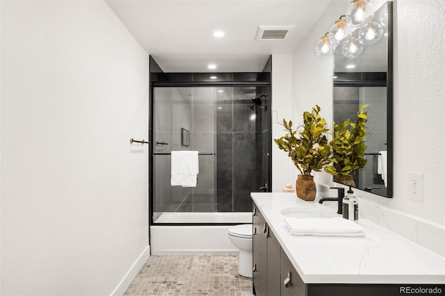 4227 Mariposa St, Denver, CO 80211 - full bath featuring vanity, toilet, combined bath / shower with glass door, recessed lighting, and tile patterned flooring
