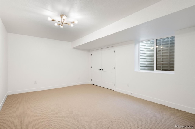 4227 Mariposa St, Denver, CO 80211 - empty room with light carpet, baseboards, and a chandelier