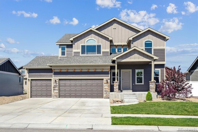 2431 Nicholson St, Berthoud, CO 80513 - craftsman-style house featuring board and batten siding, driveway, a shingled roof, and stone siding