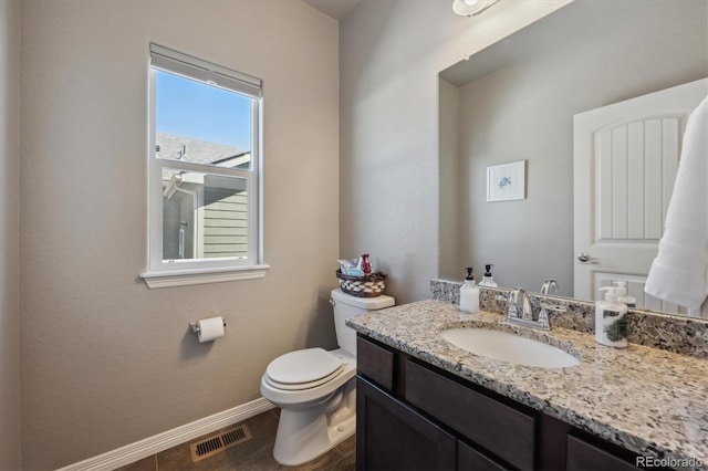 2431 Nicholson St, Berthoud, CO 80513 - bathroom featuring baseboards, toilet, and vanity