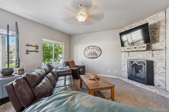 2431 Nicholson St, Berthoud, CO 80513 - carpeted living area with a ceiling fan, a fireplace, and baseboards