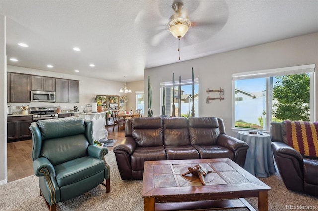 2431 Nicholson St, Berthoud, CO 80513 - living area featuring a ceiling fan, recessed lighting, and a chandelier