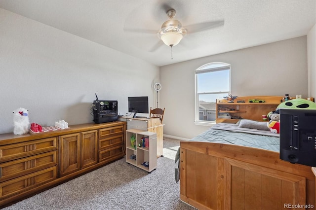 2431 Nicholson St, Berthoud, CO 80513 - bedroom with light colored carpet, a desk, and ceiling fan