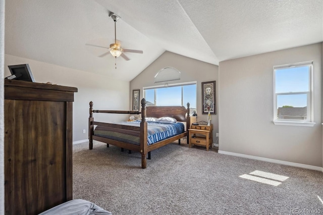2431 Nicholson St, Berthoud, CO 80513 - bedroom with vaulted ceiling, carpet, baseboards, ceiling fan, and a textured ceiling