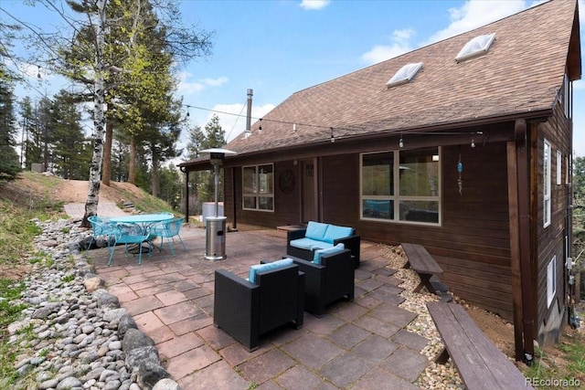 11724 Little Turtle Ln, Conifer, CO 80433 - view of patio featuring outdoor dining space and an outdoor living space