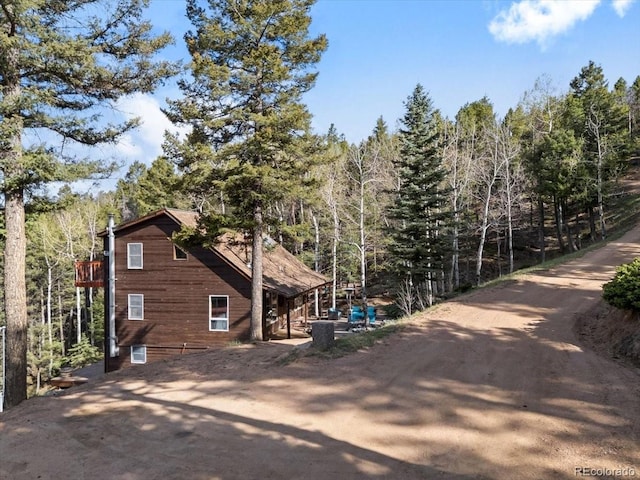 11724 Little Turtle Ln, Conifer, CO 80433 - view of property exterior with a view of trees