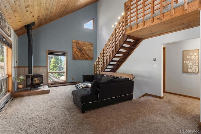 11724 Little Turtle Ln, Conifer, CO 80433 - living room with a wood stove, carpet, stairs, plenty of natural light, and high vaulted ceiling