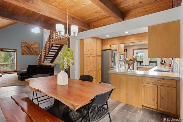 11724 Little Turtle Ln, Conifer, CO 80433 - dining space with wood ceiling, beam ceiling, light wood-type flooring, a chandelier, and recessed lighting