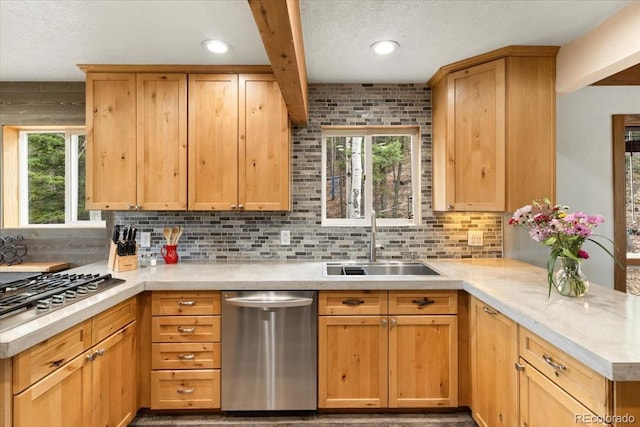11724 Little Turtle Ln, Conifer, CO 80433 - kitchen featuring stainless steel appliances, a sink, light countertops, a peninsula, and a textured ceiling