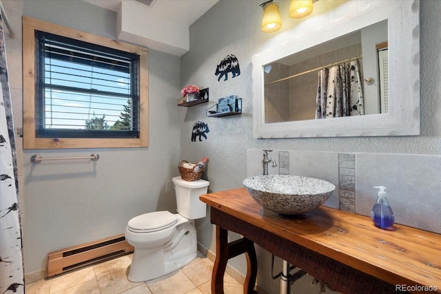 11724 Little Turtle Ln, Conifer, CO 80433 - full bathroom with a baseboard radiator, a sink, baseboards, toilet, and curtained shower
