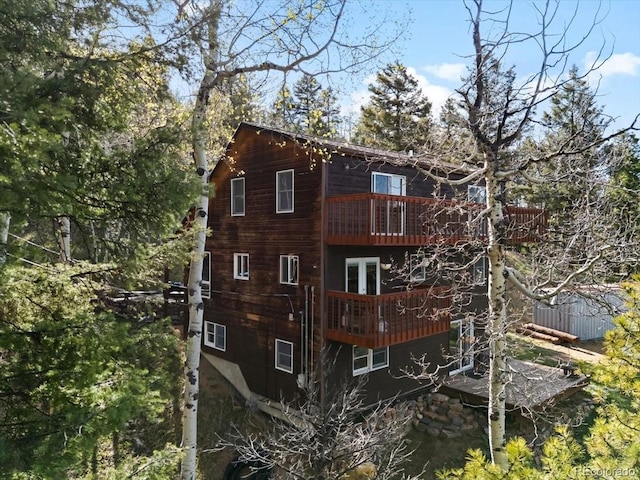 11724 Little Turtle Ln, Conifer, CO 80433 - back of house featuring a balcony