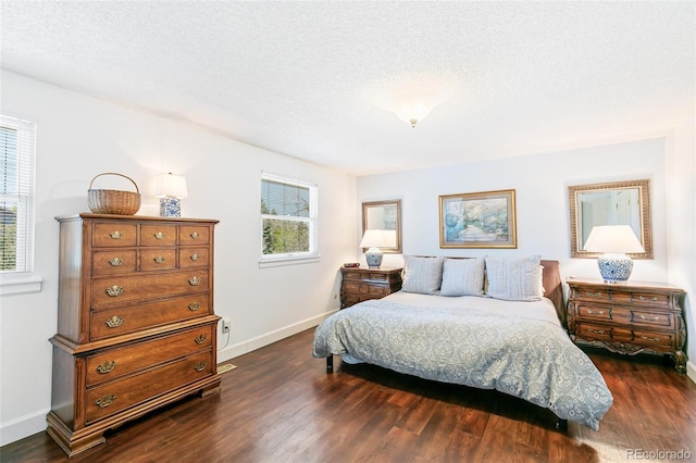 7970 S Cook Way, Centennial, CO 80122 - bedroom featuring multiple windows, dark wood-style floors, baseboards, and a textured ceiling