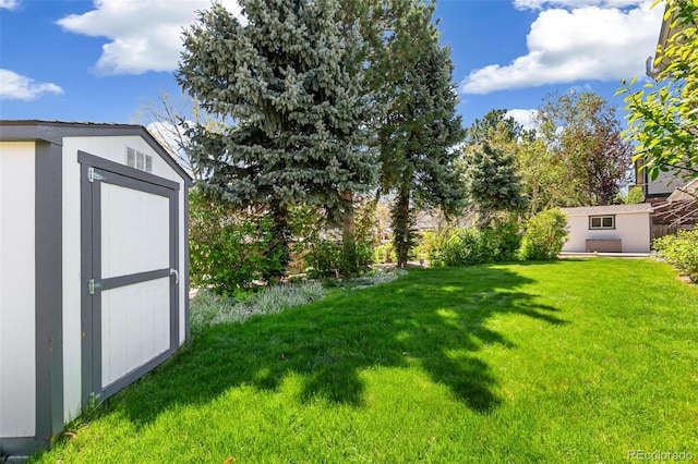 7970 S Cook Way, Centennial, CO 80122 - view of grassy yard featuring a shed and an outbuilding