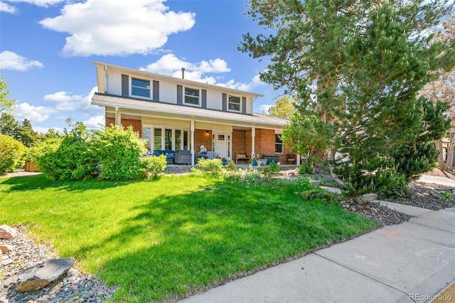 7970 S Cook Way, Centennial, CO 80122 - traditional-style home featuring brick siding, a porch, and a front yard