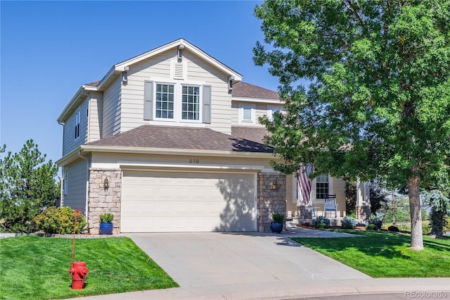 view of front of home featuring a garage and a front lawn